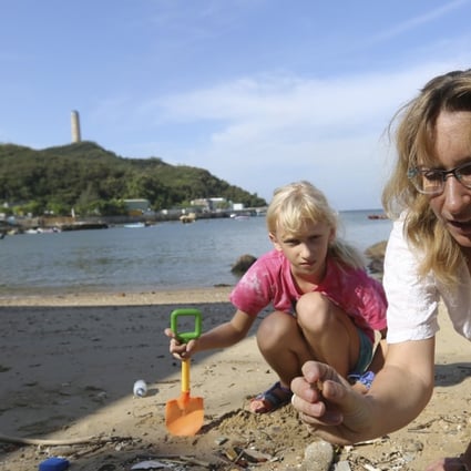 Eco warrior Jo Wilson (right) and her daughter Kate picking up rubbish from a beach on Lamma Island. Photo: Xiaomei Chen
