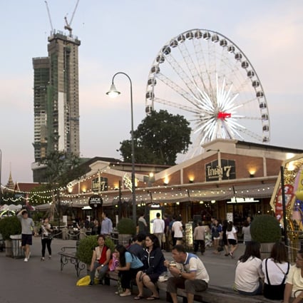 Visitors to the open-air Asiatique Riverfront mall in Bangkok. Owner TCC Land Asset World says new projects will appear across the country over the next 10 years. Photo: Bloomberg
