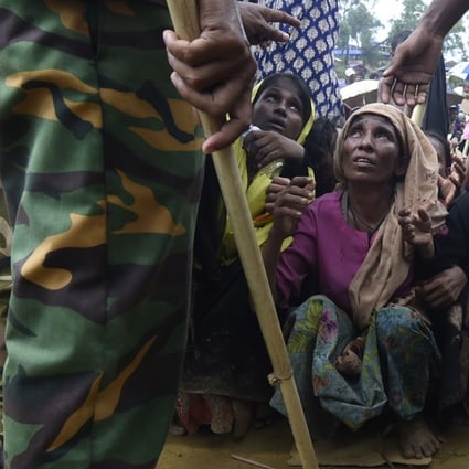 Rohingya refugees wait for food to be distributed by the Bangladesh army at the Balukhali refugee camp in Cox’s Bazar. With Bangladesh already hosting tens of thousands of Rohingya who have fled Myanmar over the years, this latest wave poses significant risks not only to Bangladesh, but to the region as a whole. Photo: AFP