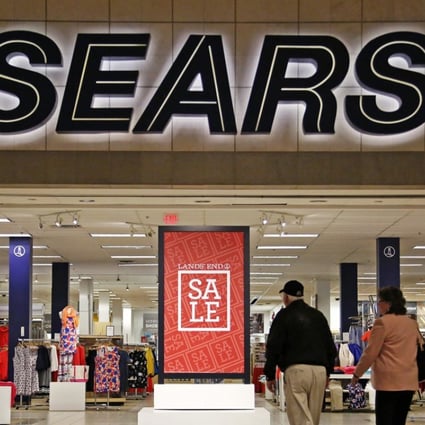 Shoppers walk into a Sears store in Pittsburgh. Department stores may be struggling to draw customers, but they have not relinquished their hold on America’s malls. Photo: AP