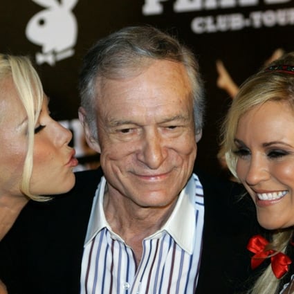 Playboy magazine founder Hugh Hefner arrives with girlfriends Kendra Wilkinson (left) and Bridget Marquardt for his 80th birthday party in Munich's famous club P1 in 2006. Photo: Reuters