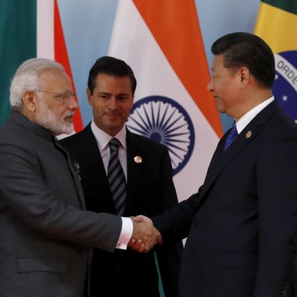 Chinese President Xi Jinping (right) greets Indian Prime Minister Narendra Modi and Mexico's President Enrique Pena Nieto before a group photo session on the sidelines of the 2017 BRICS Summit in Xiamen, China, on September 5. Photo: EPA-EFE