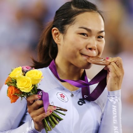 Lee Wai-sze bites her bronze medal at the London Olympics in 2012. Photo: SCMP