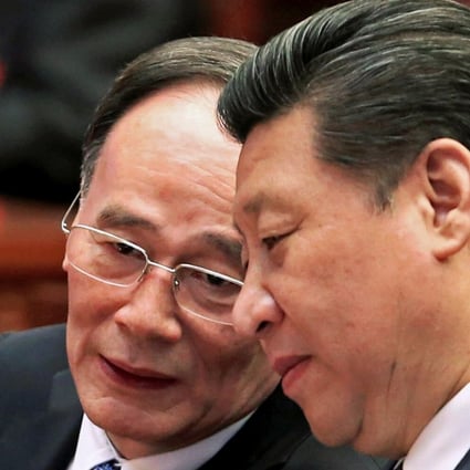 Politburo Standing Committee member Wang Qishan (left) and Communist Party general secretary Xi Jinping in Beijing in March 2015. Photo: Reuters