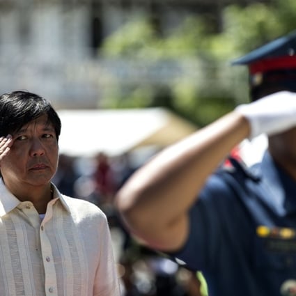 Ferdinand ‘Bongbong’ Marcos Jnr offers a wreath at a monument to his father. Photo: AFP