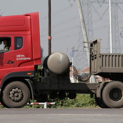 A liquefied natural gas truck drives along a road in Yutian county, China’s Hebei province. Sales of large LNG trucks are expected to hit record levels in China this year as the government steps up its anti-pollution campaign. Photo: Reuters