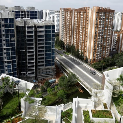 A view of a condominium construction site next to a public housing estate in Singapore. Home prices in the city state will rise by 3 to 5 per cent this year, according to a report released last week by Daiwa Capital Markets. Photo: Reuters