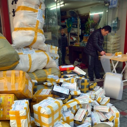 The owner of a Taobao online store prepares packages in Ningbo, Zhejiang province. Picture: Alamy