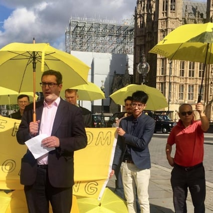 Benedict Rogers (centre) speaking at a demonstration for Hong Kong democracy outside Parliament House in London on September 28. Source: Twitter
