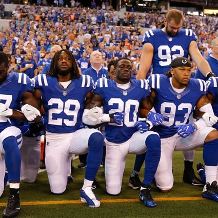 Members of the Indianapolis Colts kneel for ’The Star Spangled Banner’. Photo: AFP