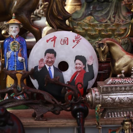 A jade plaque with a picture of Chinese President Xi Jinping and his wife Peng Liyuan below the words ‘China Dream’. Photo: EPA