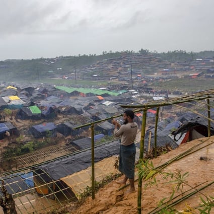 A Rohingya Muslim man, who crossed over from Myanmar into Bangladesh, builds a shelter for his family in Taiy Khali refugee camp, Bangladesh. Photo: AP
