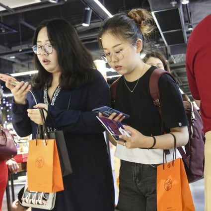 China’s online consumer credit providers have benefited from the country’s spending boom and lending to consumers who cannot obtain credit from traditional financial institutions. Photo: Edward Wong