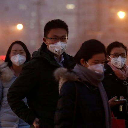 People wear face masks on a polluted day in Beijing. More than 1.8 million Chinese died from pollution-related illnesses in 2015, a new study has said. Photo: Reuters