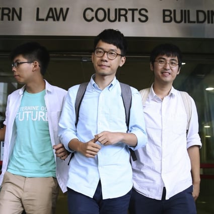 Occupy Central student leaders Joshua Wong Chi-fung, Nathan Law Kwun-chung and Alex Chow Yong-kang, seen here outside the magistrates’ courts in July last year, were convicted by a magistrate and originally given non-custodial sentences. Photo: Sam Tsang.