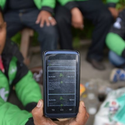 A driver with the motorbike-hailing app by Indonesian start-up Go-Jek in Jakarta. Photo: AFP
