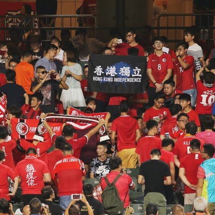 Hong Kong soccer fans turn their backs on the national anthem before a match. Photo: Dickson Lee