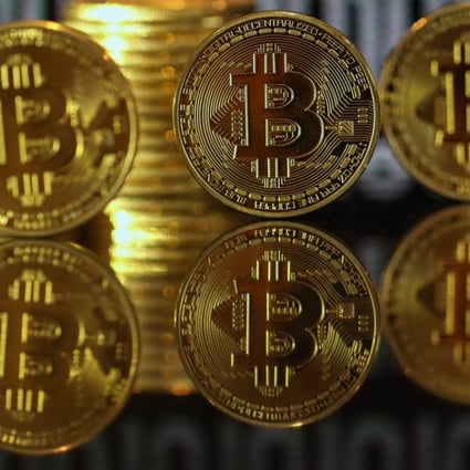 A collection of bitcoin tokens. A former US regulator told a conference in Hong Kong that more regulation of virtual currencies was on the way as governments worried about their stability. Photo: Bloomberg