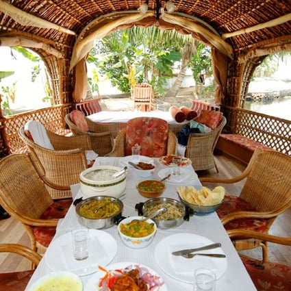 The dining area in a luxury houseboat in Alappuzha. Pictures: Alamy
