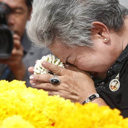 A Thai mourner pay respects to the late Thai King Bhumibol Adulyadej. Photo: EPA