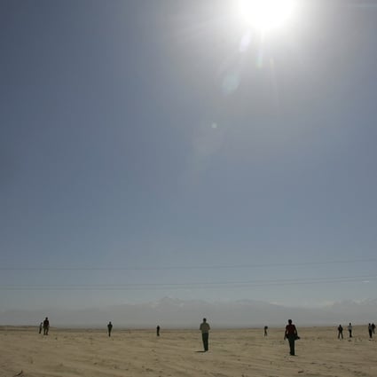 The desert sun shines above the Taklimakan Desert east of Hotan in Xinjiang in October 2006. Photo: AFP