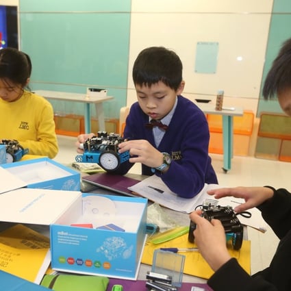 Students at a Hong Kong primary school learning robotics. US firm Wonder Works sees growing demand for its educational robots in Asia as the importance of science and technology learning increases. Photo: K.Y. Cheng