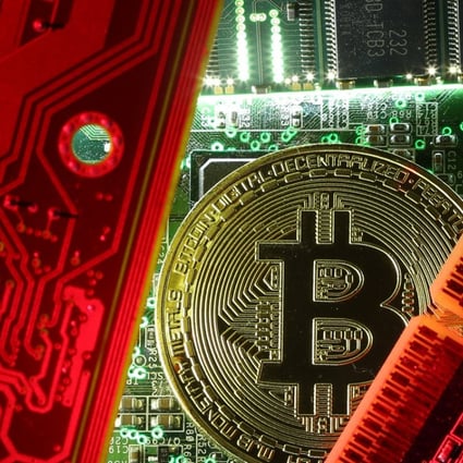 A copy of bitcoin standing on PC motherboard is seen in this illustration picture, October 26, 2017. Photo: Reuters