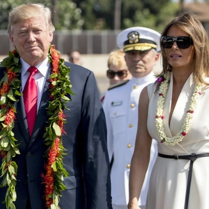 US President Donald Trump and first lady Melania Trump wear leis as they arrive at Joint Base Pearl Harbor Hickam in Hawaii. Photo: AP