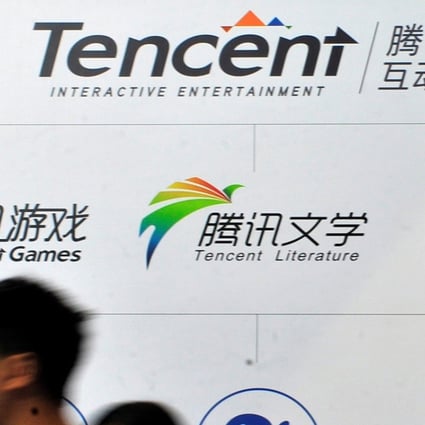 People walk past a logo of Tencent Literature at a Tencent Interactive Entertainment stand during a book fair in Guangzhou in August. Photo: Reuters