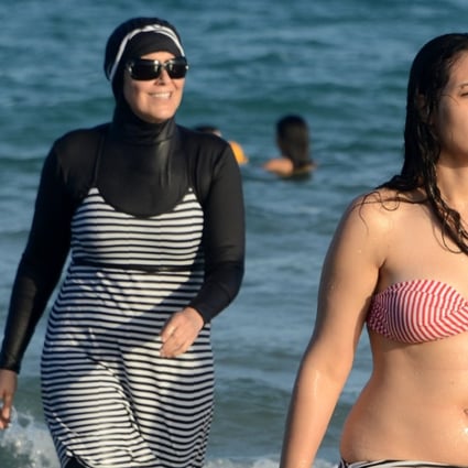 A Tunisian women wears a burkini at Ghar El Melh beach near Bizerte, northeast of the capital Tunis. File photo: AFP