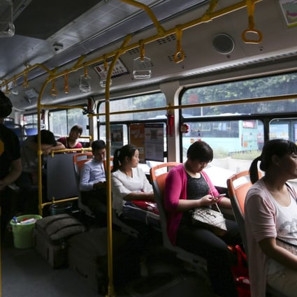 Passengers aboard an electric bus in Shenzhen. Picture: Xiaomei Chen