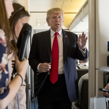 US President Donald Trump speaks to reporters aboard Air Force One on Saturday. Photo: AP