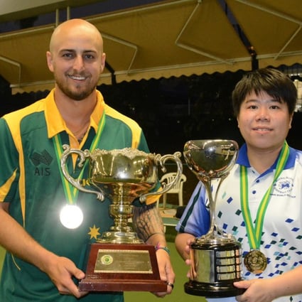 Jesse Noronha and Vivian Yip show off their trophies after winning their singles final on Sunday. Photo: Handout