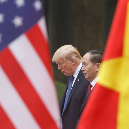 US President Donald Trump meets Vietnamese President Tran Dai Quang at the Presidential Palace in Hanoi on Saturday. Photo: AFP