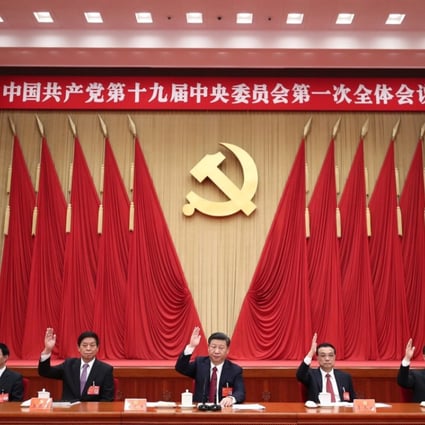 Politburo Standing Committee members (from left) Han Zheng, Wang Huning, Li Zhanshu, Xi Jinping, Li Keqiang, Wang Yang and Zhao Leji attend the first plenary session of the 19th Central Committee at the Great Hall of the People in Beijing on October 25. Photo: Xinhua