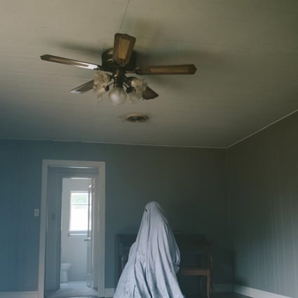 Casey Affleck performs underneath a sheet in the film A Ghost Story.