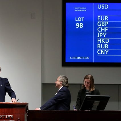 Christie’s global president Jussi Pylkkanen takes the winning hammer bid of US$400 million on “Salvator Mundi” by Leonardo da Vinci at auction in New York. The buyer will pay a total of US$450.3 million for the painting. Photo: EPA