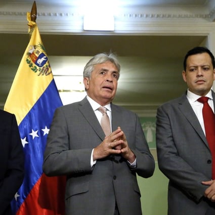 Venezuelan Economy and Finance Minister Simon Zerpa (R), Venezuelan vice-president for economic area Wilmar Castro Soteldo (C) and Venezuelan ambassador to Russia Carlos Rafael Faria Tortosa (L) attend a briefing on signing a deal between Venezuela and Russia to restructure the Latin American country’s debt. Photo: EPA-EFE