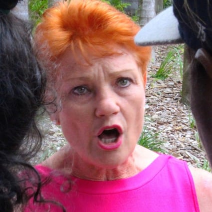 Australian senator Pauline Hanson speaks to local Aboriginal people in the northern Australian town of Rockhampton. Photo: Reuters