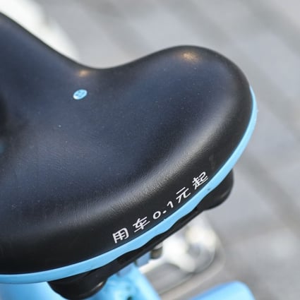 A price of 0.1 yuan is printed on the seat of a Bluegogo bike-sharing bicycle in the Futian district of Shenzhen. Photo: Roy Issa