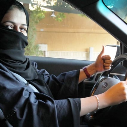 A woman behind the wheel in Riyadh – Saudi Arabia’s ban on female drivers will be lifted next year. Photo: EPA