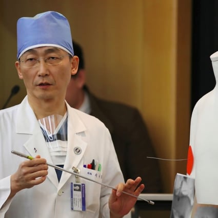 South Korean doctor Lee Cook-jong, who carried out surgery on gunshot wounds sustained by a North Korean soldier, speaks about the condition of the soldier during a briefing at Ajou University Hospital in Suwon, south of Seoul, on November 15. Photo: Agence France-Presse