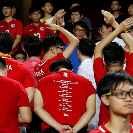 Hong Kong fans turn their backs during the Chinese national anthem, other fans booed, but the Chinese government could force the SAR to enact its laws on disrespecting the national anthem. Photo: Reuters
