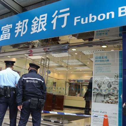 Hong Kong police officers investigate a robbery case at Fubon Bank in Tsim Sha Tsui in December 2016. Voiceprint recognition technology will make it easier for law enforcement to identify criminals. Photo: Nora Tam