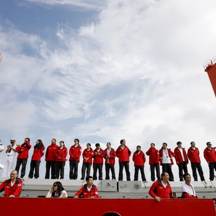 Members of the Chinese scientific expedition team line up on the icebreaker Xue Long as they return to Shanghai on October 10. The Xue Long (Snow Dragon) spent 83 days on the Arctic rim, completing its eighth Arctic expedition. Photo: Xinhua