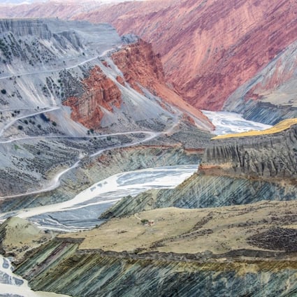 A river carves through a colourful canyon in the Tianshan Mountains in Xinjiang, China. In the absence of direct sunlight, the colours and texture of the canyon are flattened into a two-dimensional oil painting. Photo: Tugo Cheng