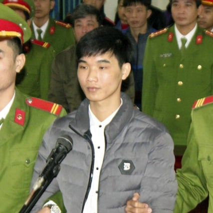Nguyen Van Hoa (centre) was sentenced to seven years in prison. Photo: AP