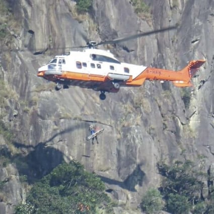 A helicopter from the Hong Kong Government Flying Service rescued the female hiker, who fell down a steep slope dubbed “suicide cliff” in Ma On Shan Country Park. Photo: Facebook