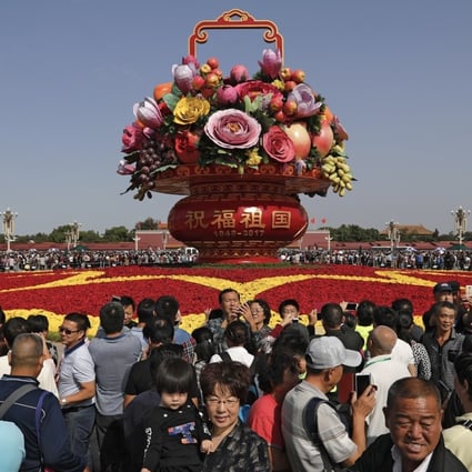 Visitors to Tiananmen Square, Beijing, on China's National Day on October 1. The number of Chinese holidaying domestically surged 10 per cent last year, much faster than the growth in the number of those going abroad. Photo: AP