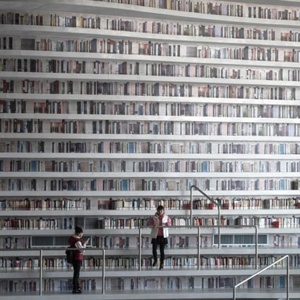 At the Tianjin Binhai Library, rows upon rows of book spines are mostly images printed on the aluminium plates that make up the backs of shelves. Photo: AFP